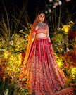 Anahita red silk bridal lehenga with mor motifs, hand embroidered by Amaltas Couture, front view