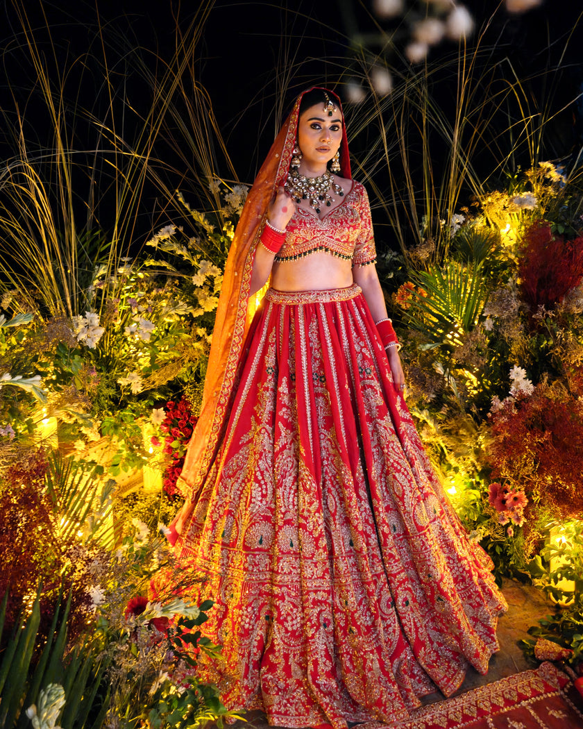 Anahita red silk bridal lehenga with mor motifs, hand embroidered by Amaltas Couture, front view