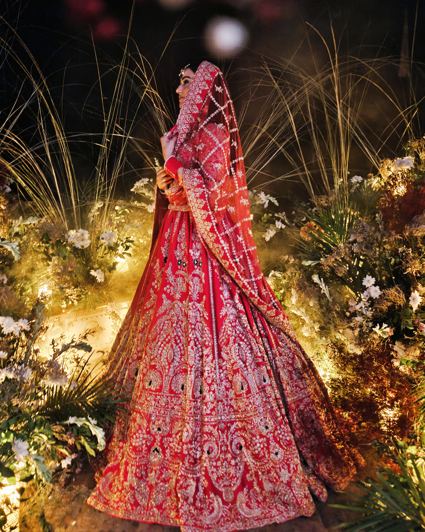 Anahita red bridal lehenga with net jaal dupatta, Amaltas Couture