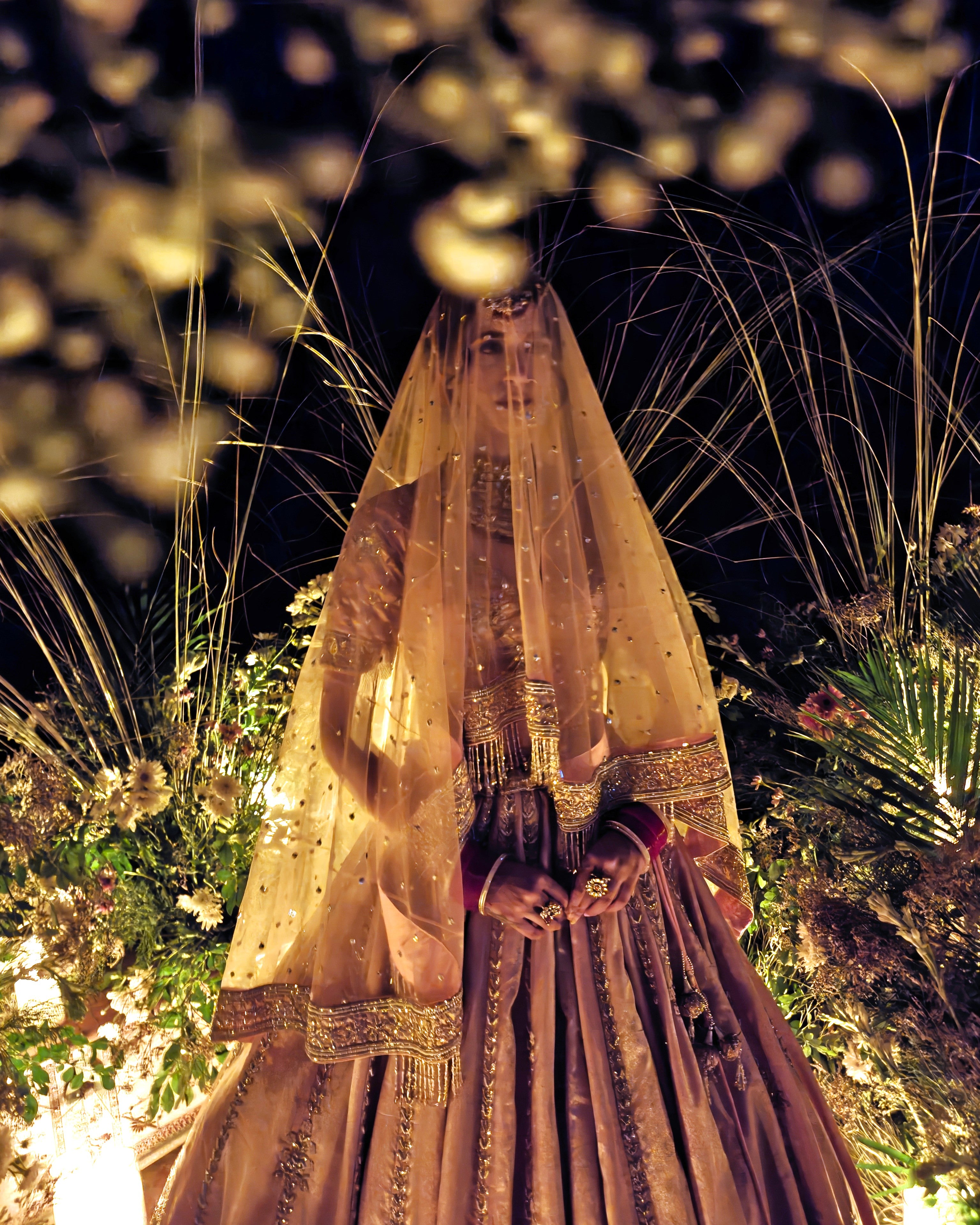 Aabida peach tissue bridal lehenga, back view, Amaltas Couture
