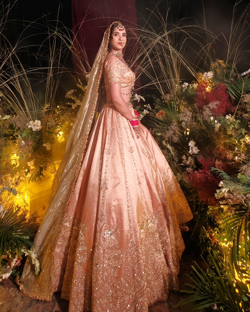 Aabida peach tissue bridal lehenga with contrast green tissue dupatta, Amaltas Couture