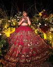 Aroosa red silk bridal lehenga with organza dupatta with green velvet border, Amaltas Couture