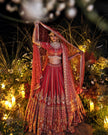 Anisa red silk bridal lehenga, hand embroidered by Amaltas Couture, front view