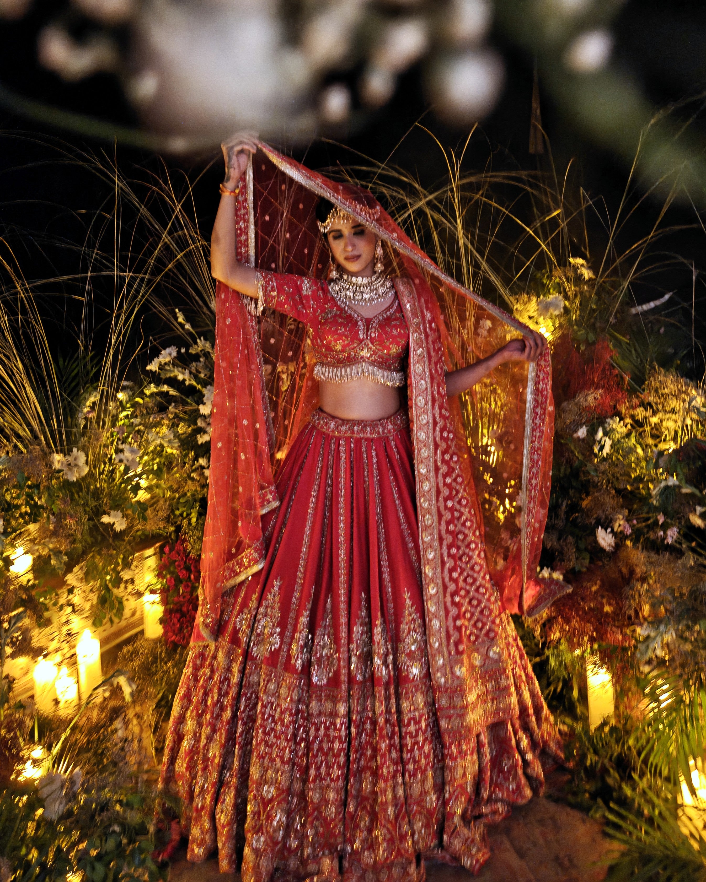 Anisa red silk bridal lehenga, hand embroidered by Amaltas Couture, front view