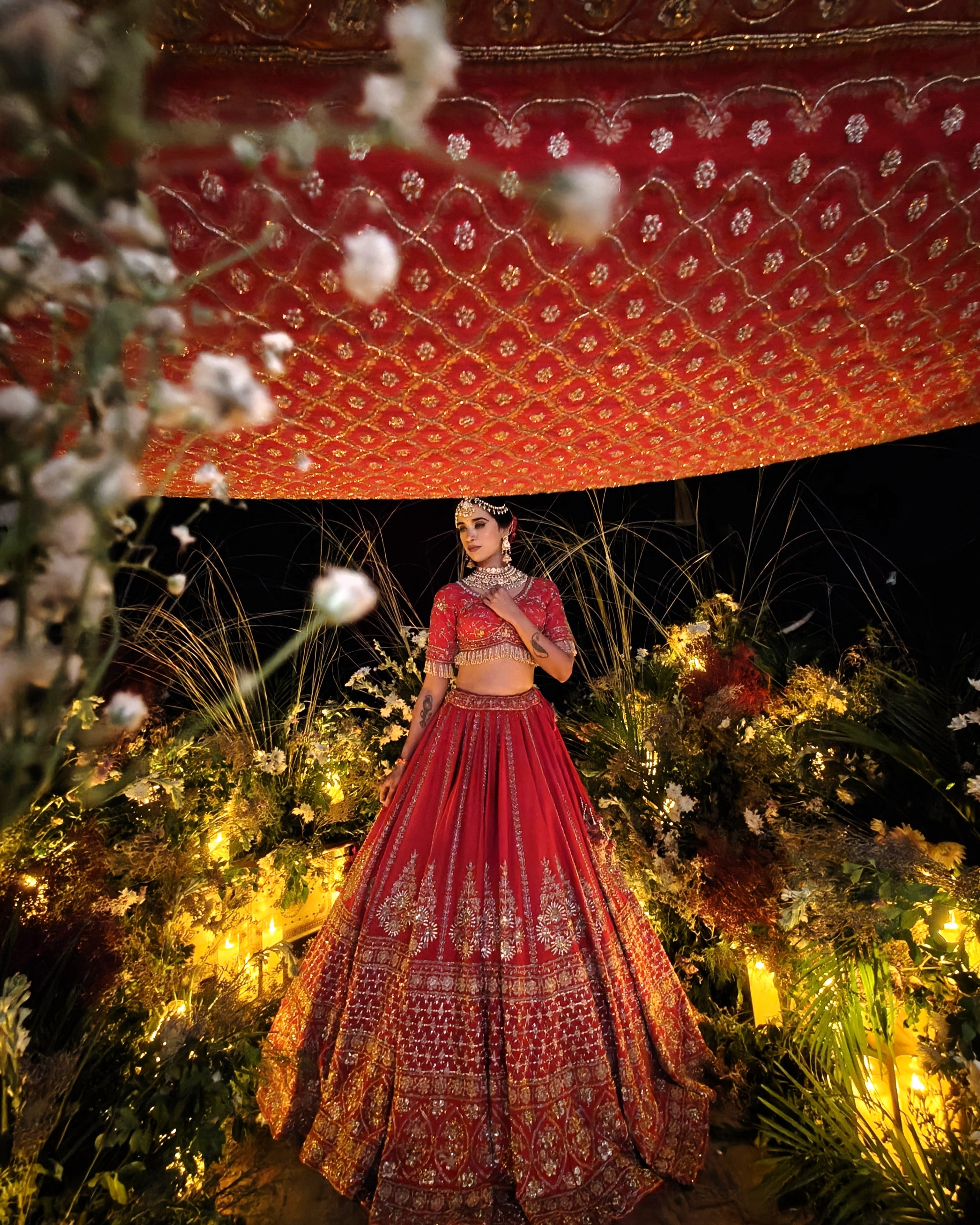 Anisa red silk bridal lehenga with bandhej and net jaal dupattas, Amaltas Couture