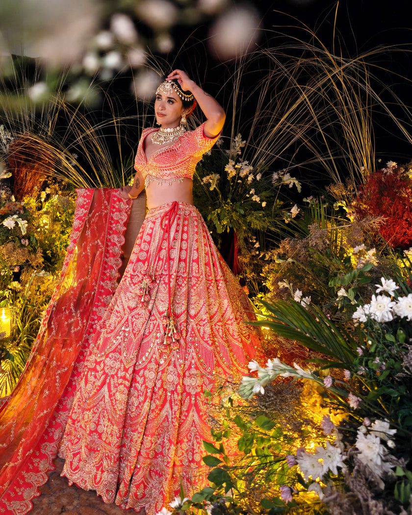 Sitara coral red silk bridal lehenga with net jaal dupatta with scalloped border, Amaltas Couture