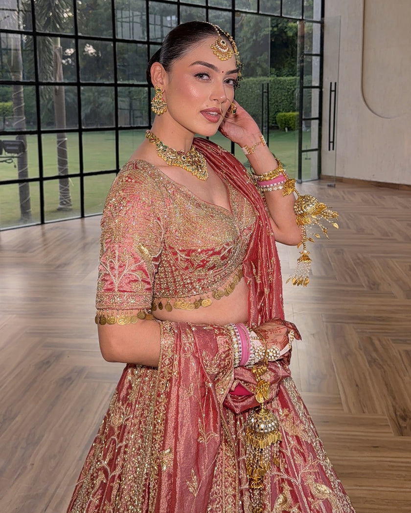 Gulrang pink tissue bridal lehenga, blouse sleeves and skirt embroidery up close, Amaltas Couture