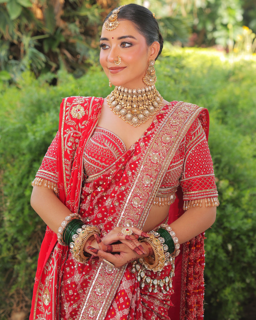 Meera red bandhej saree, hand embroidered blouse and pallu close up, Amaltas Couture
