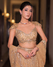 Zarina gold net fishcut bridal lehenga, hand embroidered by Amaltas Couture, front view