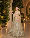 Zarina gold net fishcut bridal lehenga, hand embroidered by Amaltas Couture, front view