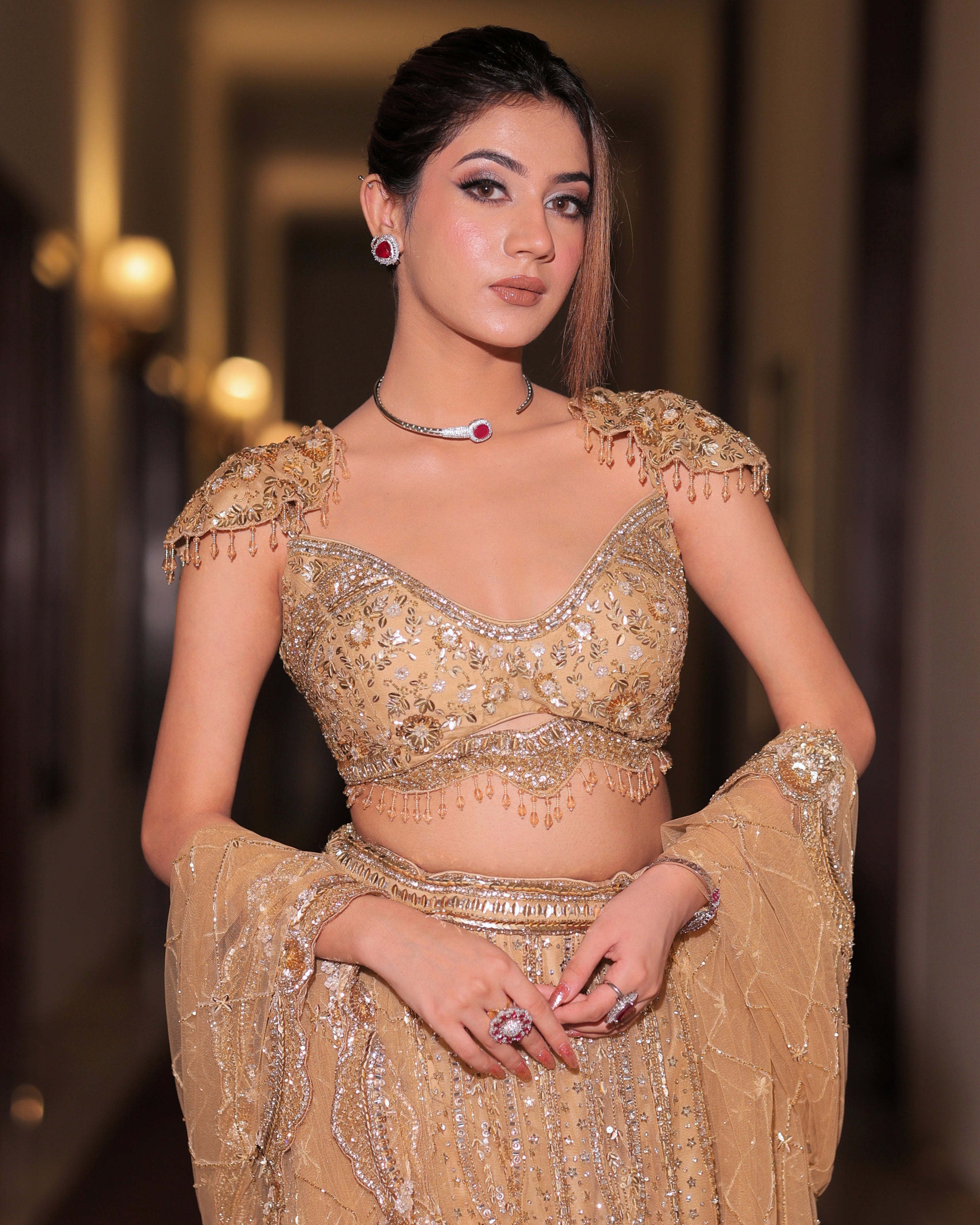 Zarina gold net fishcut bridal lehenga, hand embroidered by Amaltas Couture, front view