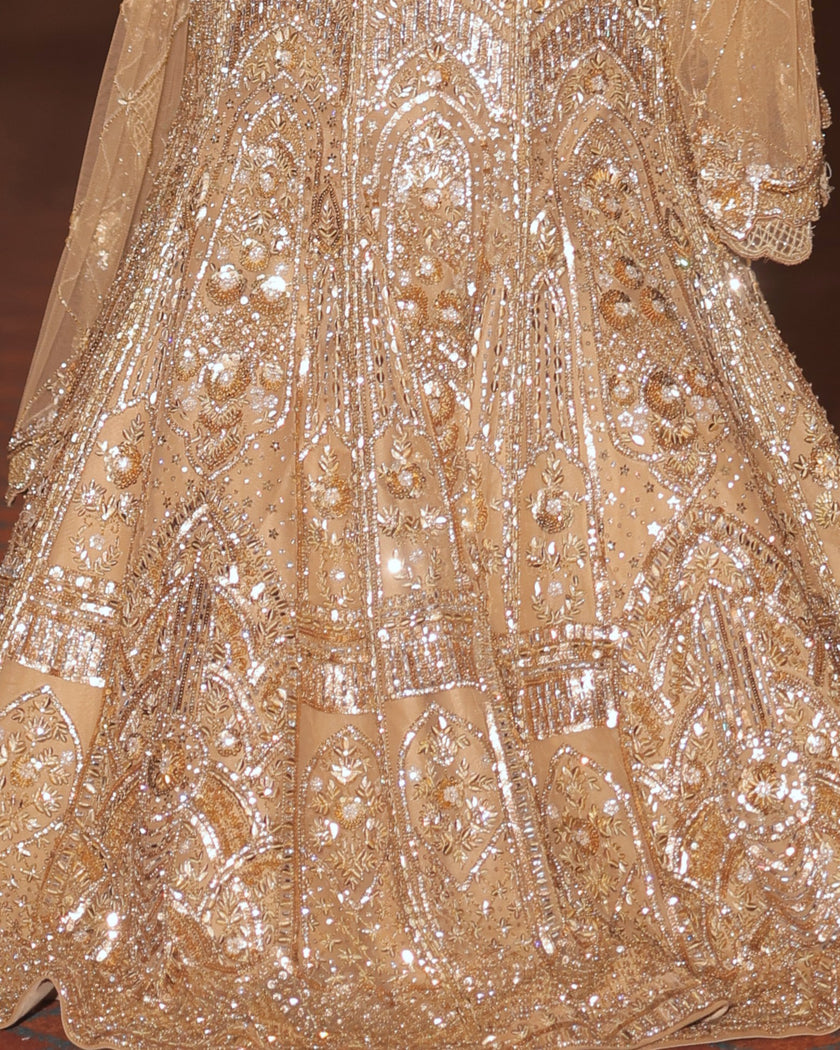 Zarina gold net bridal lehenga, fitted fishcut silhouette, hand embroidered, Amaltas Couture